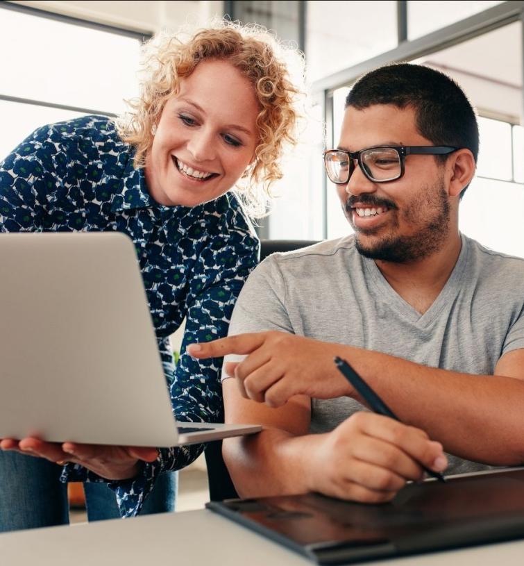 Two people working together on computer